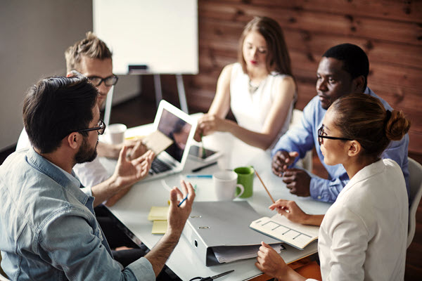 A group of coworkers in a collaborative meeting.