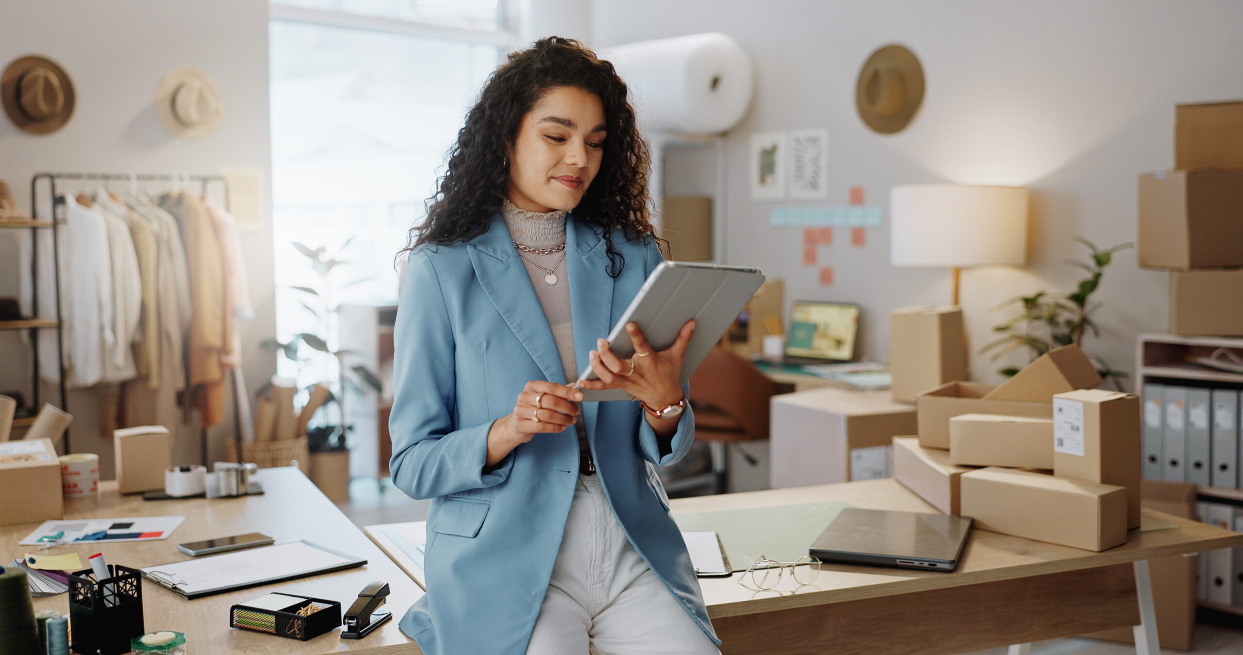 Business Woman, Fashion Designer And Tablet In Logistics, Research Or Management At Boutique. Female Person Or Entrepreneur Working On Technology In Storage Or Inventory Check Or Ecommerce App